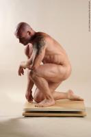 Photo Reference of peter kneeling pose 009