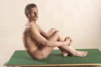 Photo Reference of ales sitting pose 01