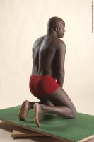 Photo Reference of david kneeling pose 30